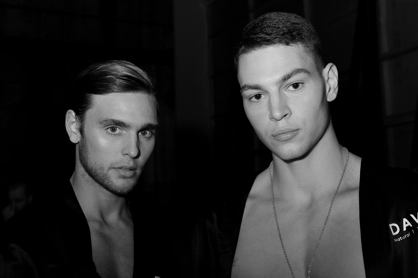 black and white backstage fashion week sydney male models pose image 1