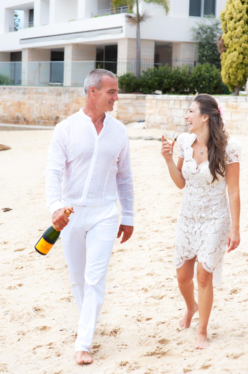 candid wedding on the beach champagne tell a story 11
