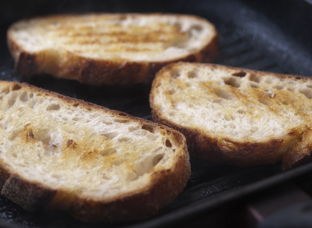 sourdouh bread oil garlic toasted on pan 3