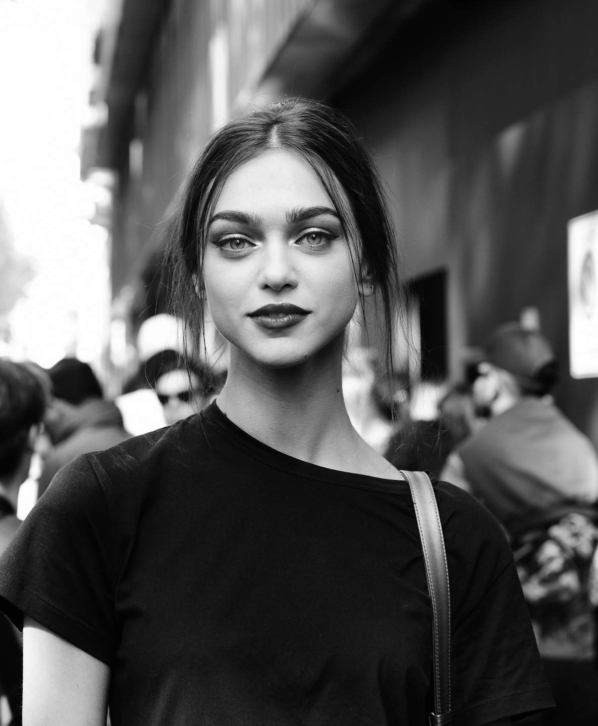 street style milan fashion week outside of dolce gabbana zhenya katava poses for the cameras editorial black and white image 13